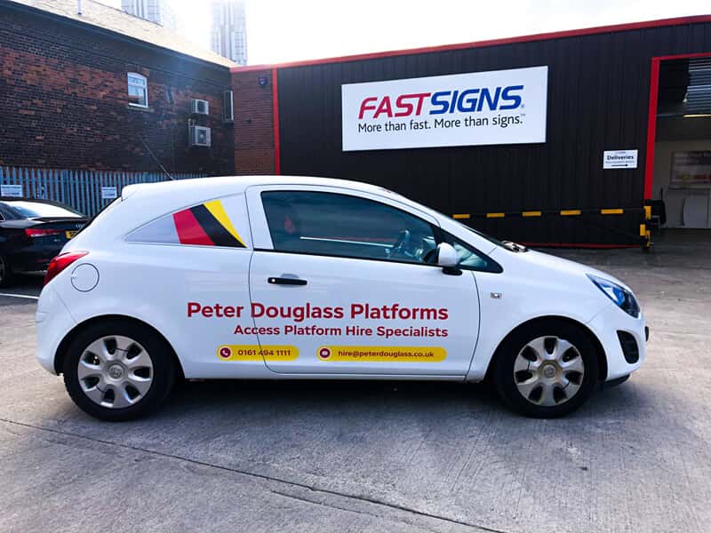 An image of a hatchback with a Peter Douglass Platforms vehicle graphics.